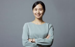Image of an asian woman with arms crossed
